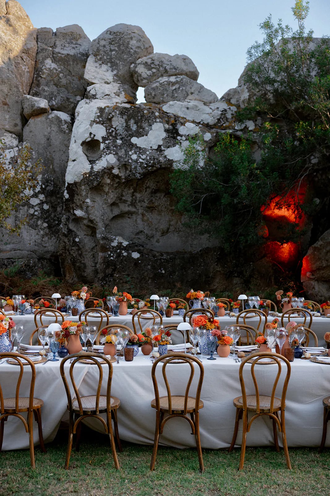 Tables set against the estate's rocks